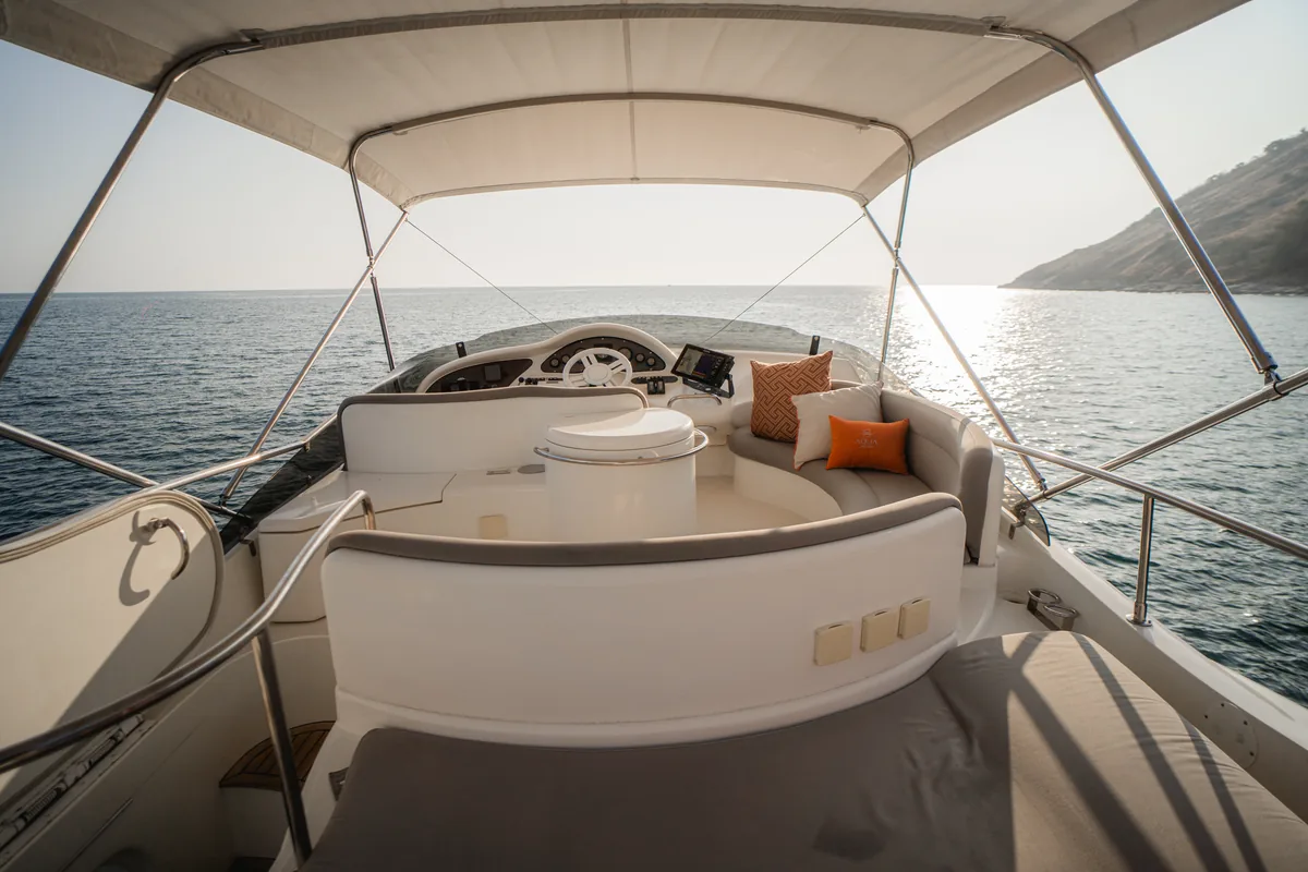 Azimut 46 Aqua Mas — flybridge seating area shaded by the bimini