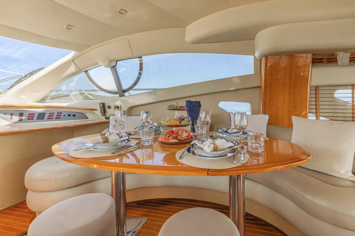 Azimut 55 After 8 — salon dining table laid for lunch