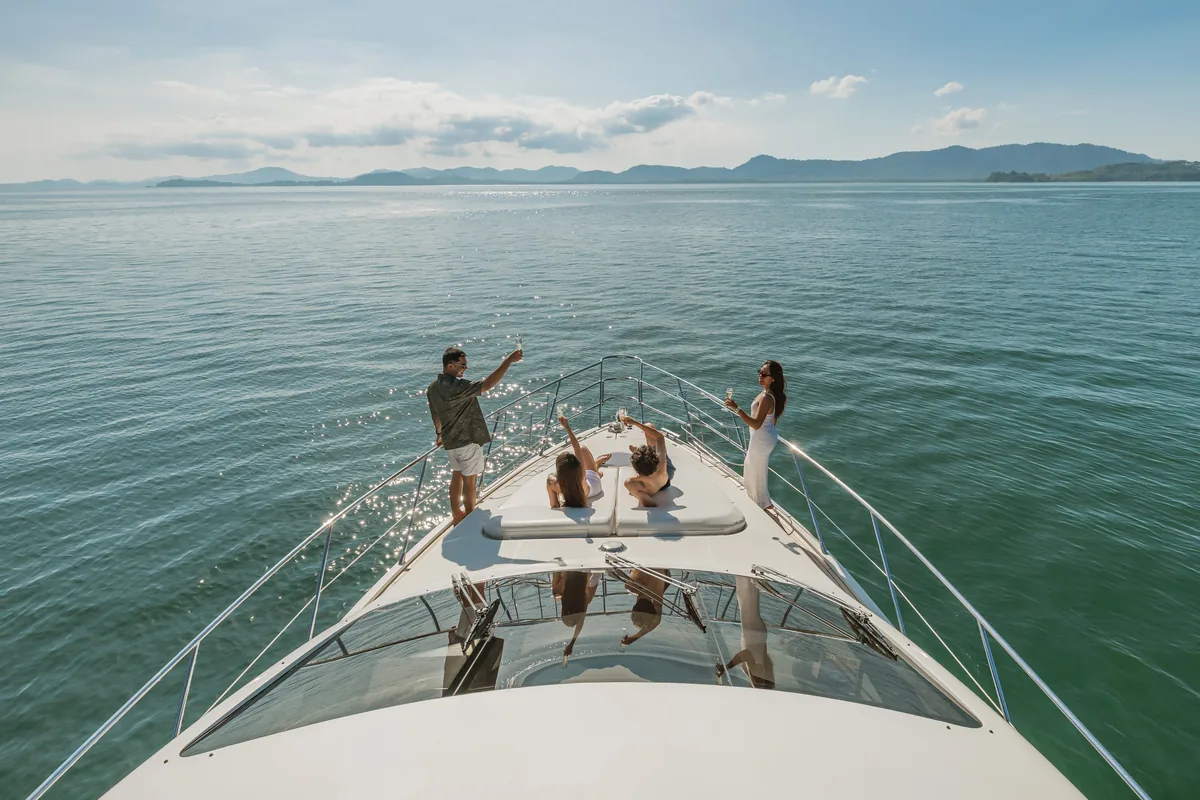 Azimut 55 After 8 — guests relaxing on the foredeck