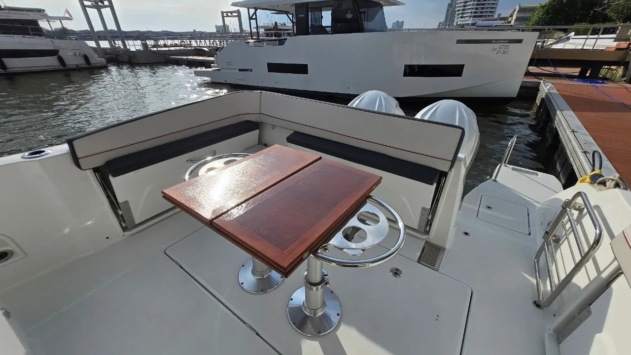 Jeanneau Cap Camarat 10.5 — aft cockpit dining table