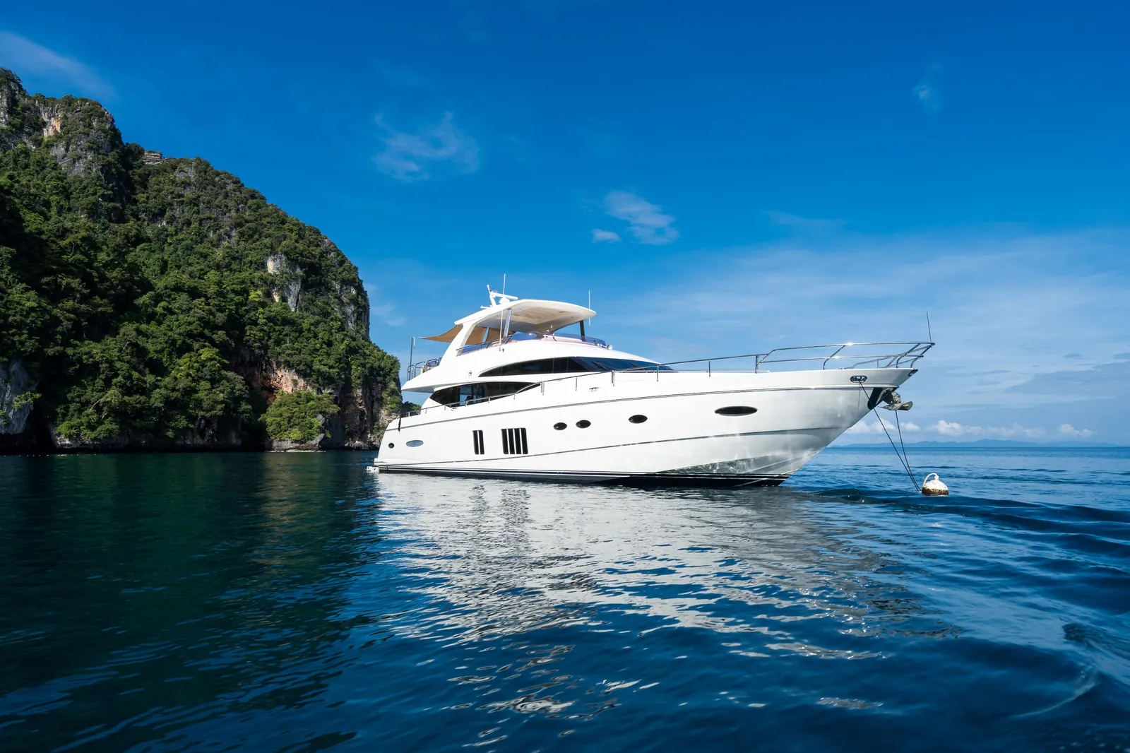 Princess 78 Maritimus — at anchor beside a limestone island