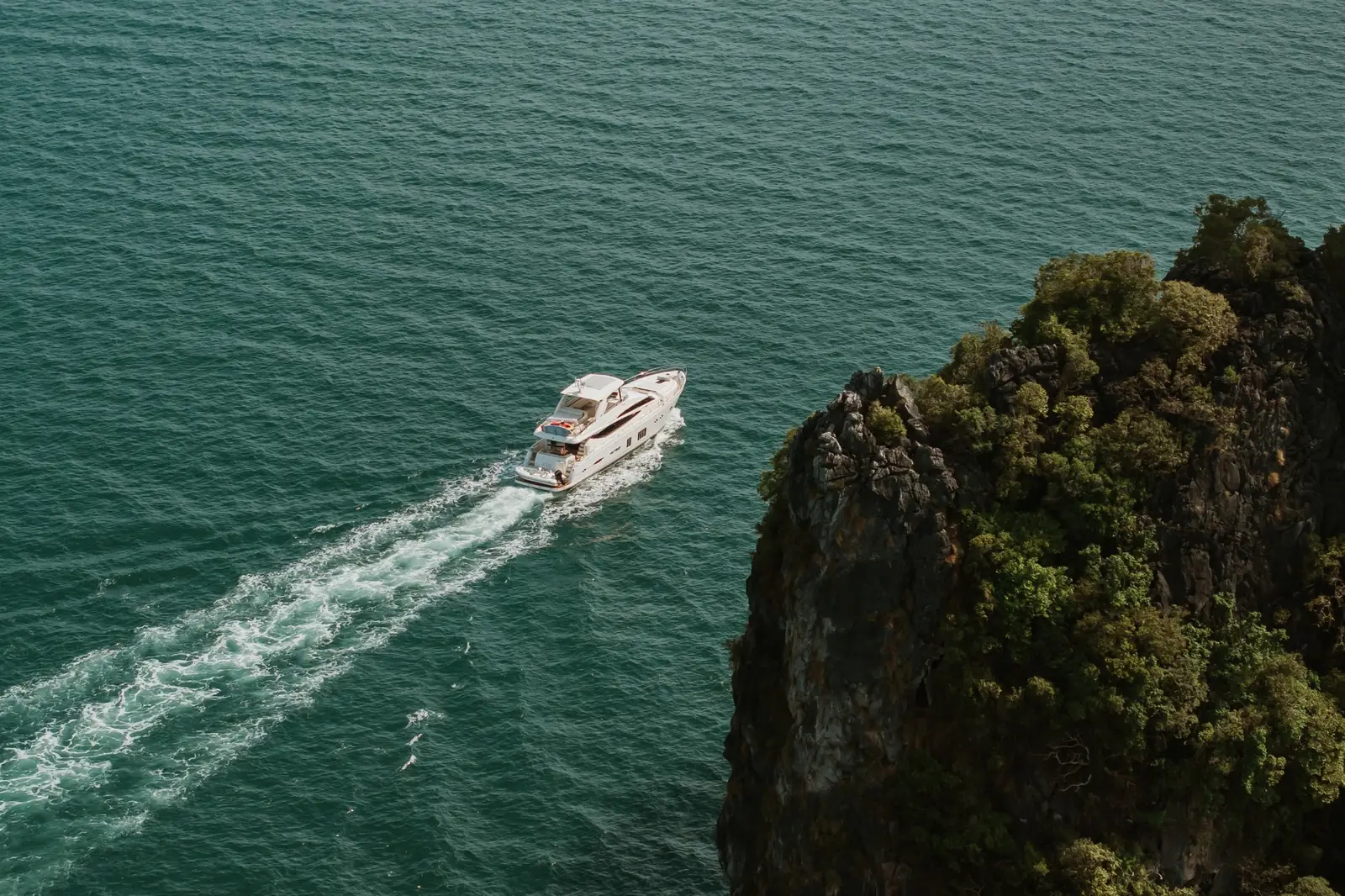 Princess 78 W.J. Lip — under way past a limestone island