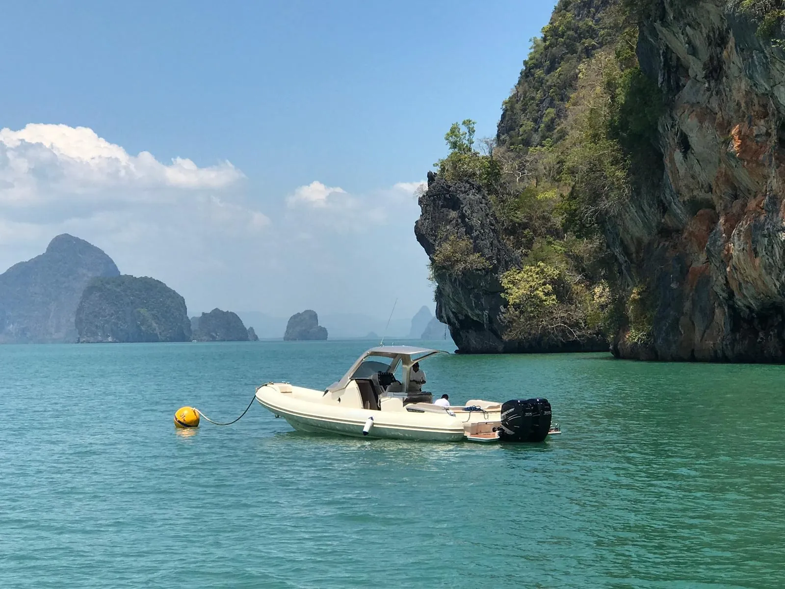 Sacs Strider 11 — moored off a karst island