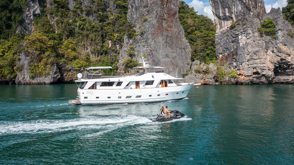Siam Princess 70 — under way with the tender alongside