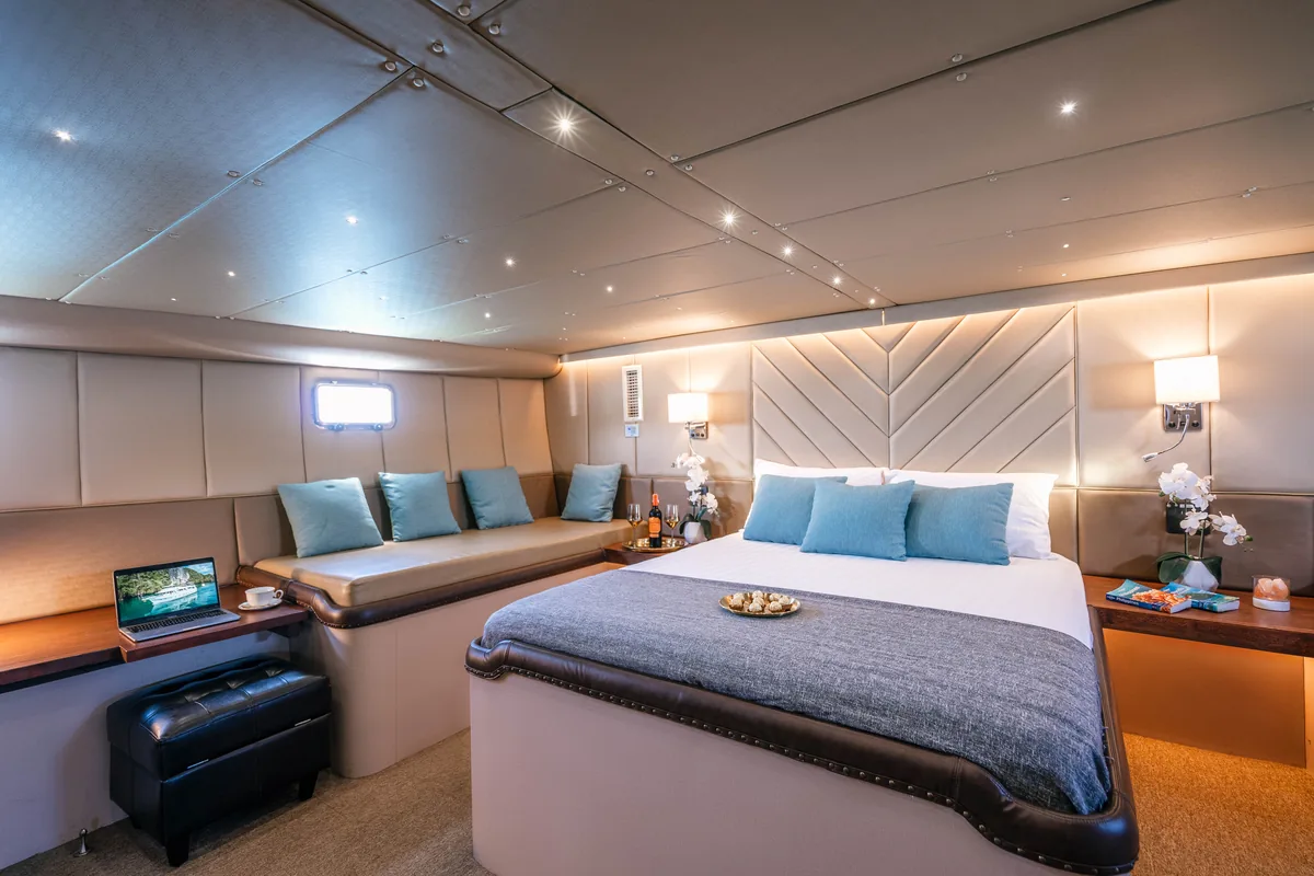 Siam Princess 70 — master cabin with television and seating