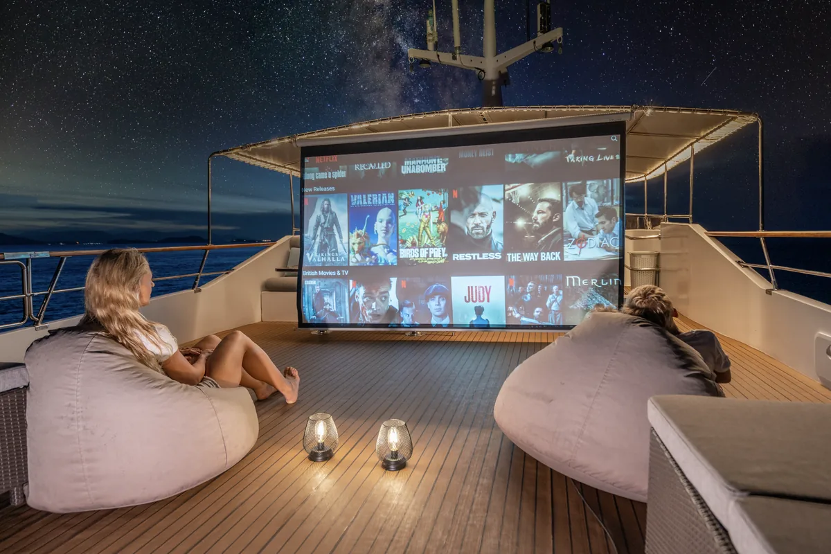 Siam Princess 70 — outdoor cinema screening on deck at night